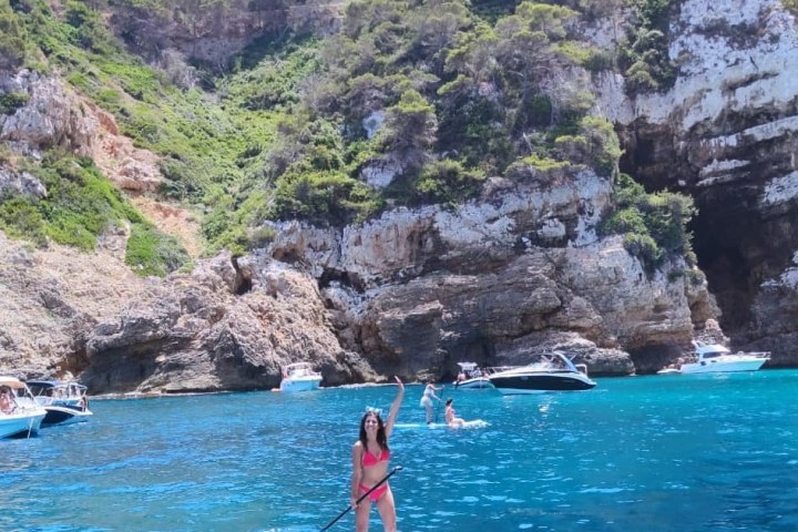 a group of people paddling in the water