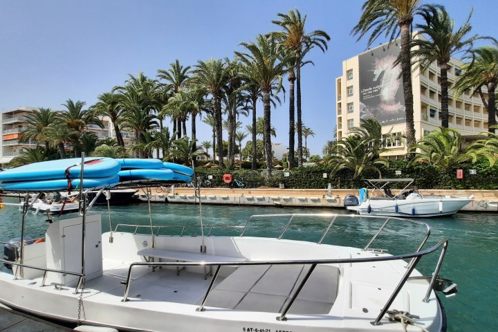 a boat is docked next to a body of water