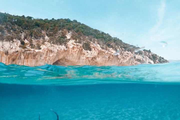 a man swimming in a body of water