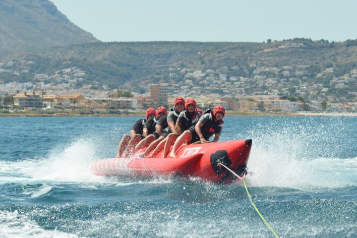 a man water skiing behind a boat