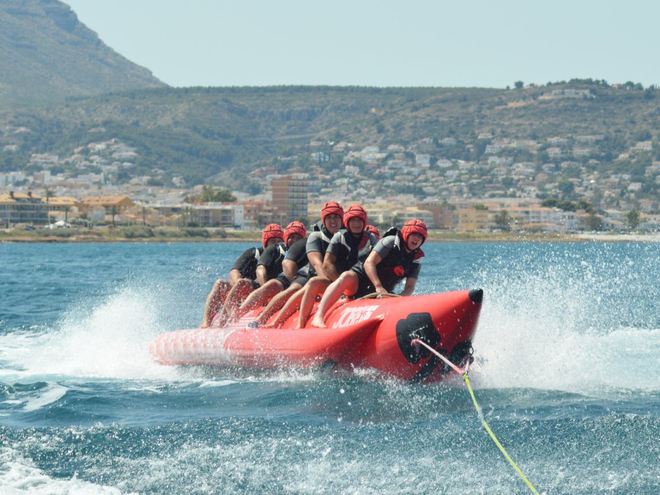 a group of people riding a banana boat