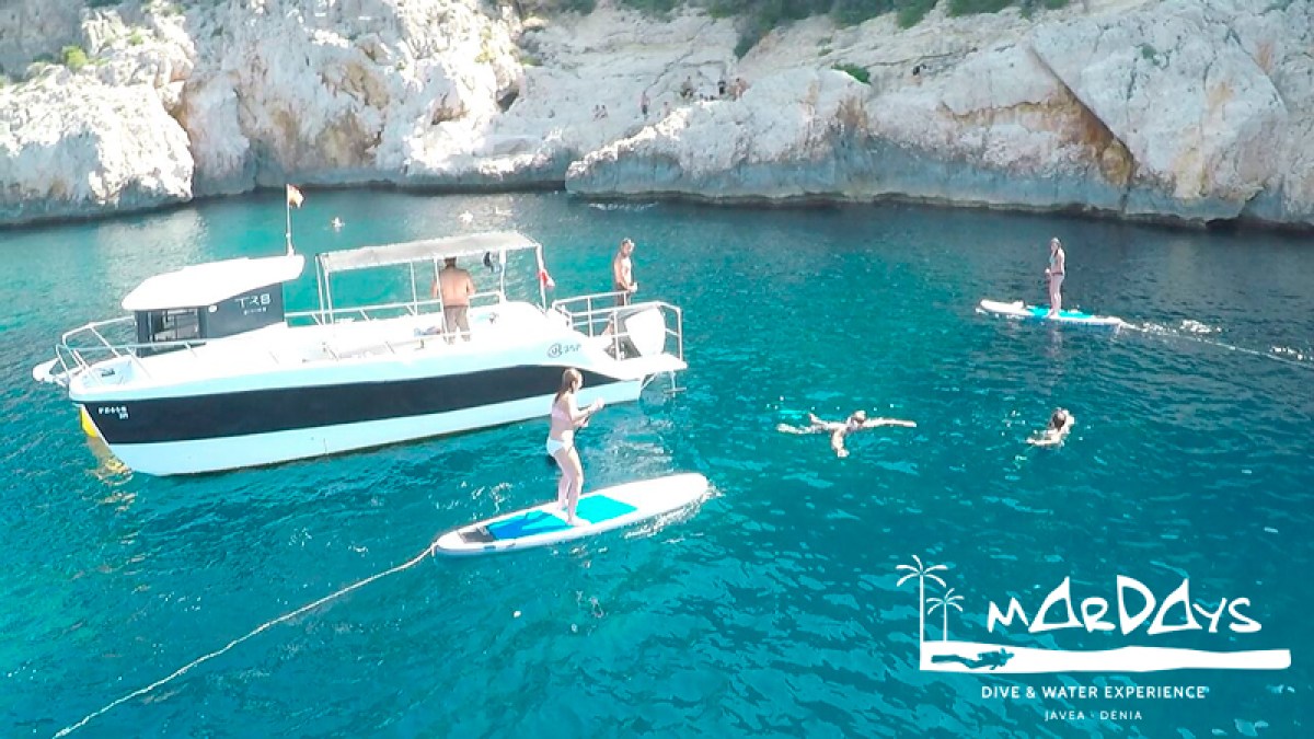 a group of people on a boat in the water