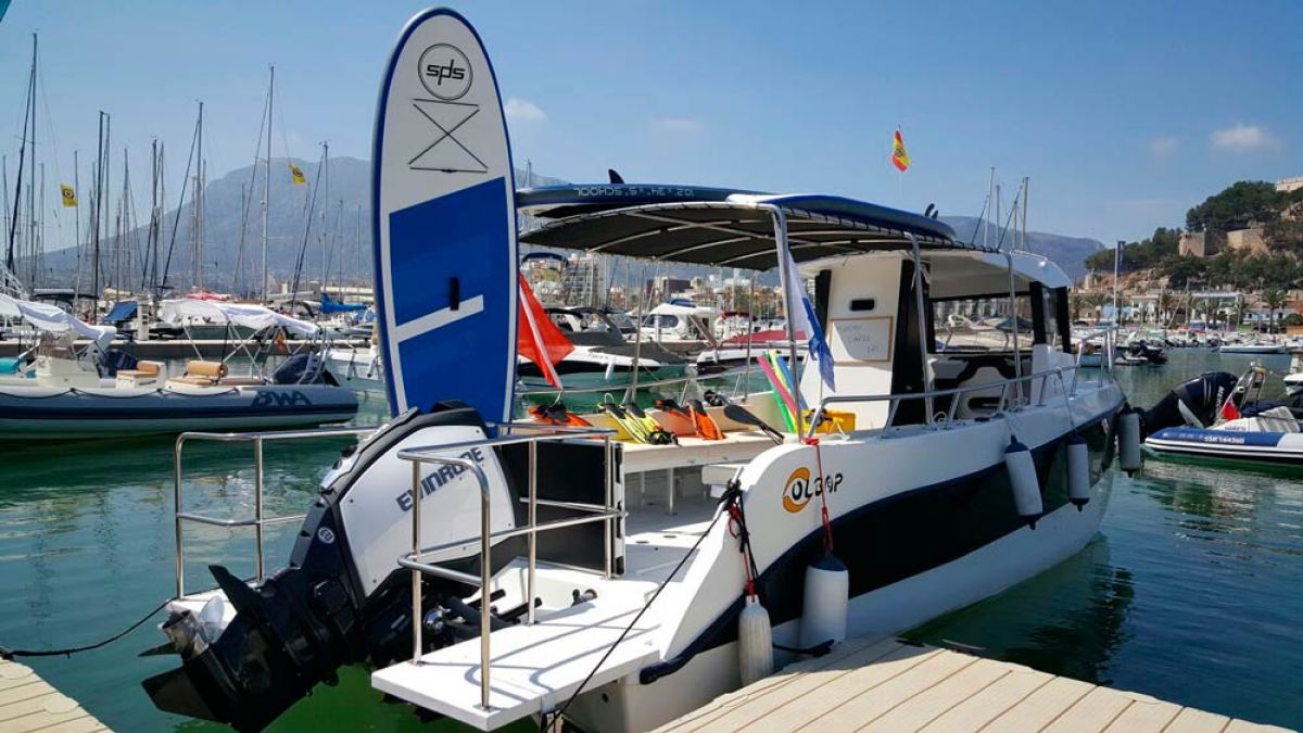 a boat is docked next to a body of water
